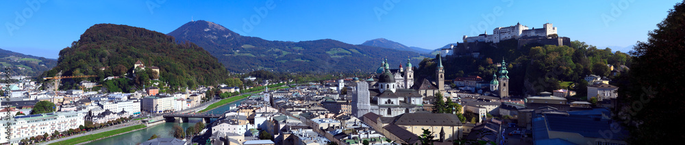 Panoramic view of the city of Salzburg on a summer day, view of the hill of the castle and the river, Salzburg, Austria.