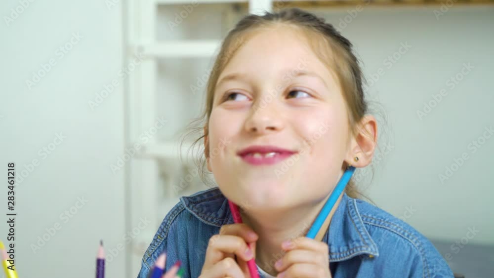 funny little girl making faces with colored pencils as moustache funny little girl making faces with colored pencils as moustache