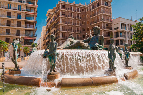 Принти на полотні Valencia, Spain - 07/21/2019: A Fountain - Neptune surrounded by eight naked wom