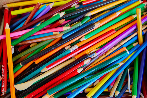 A big pile of school colored wooden pencils