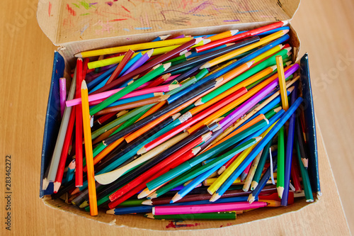 A big pile of school colored wooden pencils