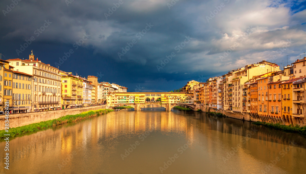 View of medieval stone bridge Ponte Vecchio over Arno river in Florence, Tuscany, Italy. Beautiful Florence after the rain. Florence architecture and landmark.