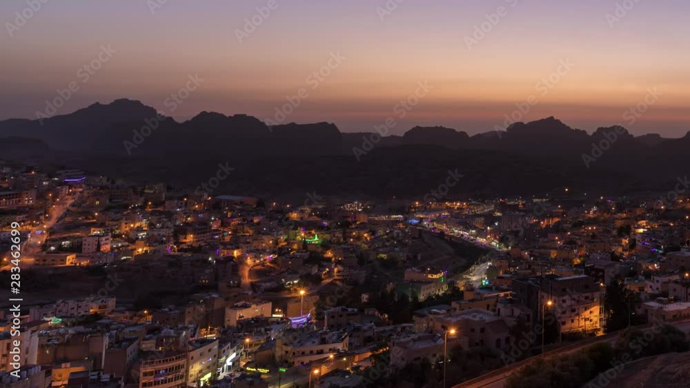 Petra and Wadi Musa City by Night (time lapse zoom out shot) Petra and Wadi Musa City by Night (time lapse zoom out shot)