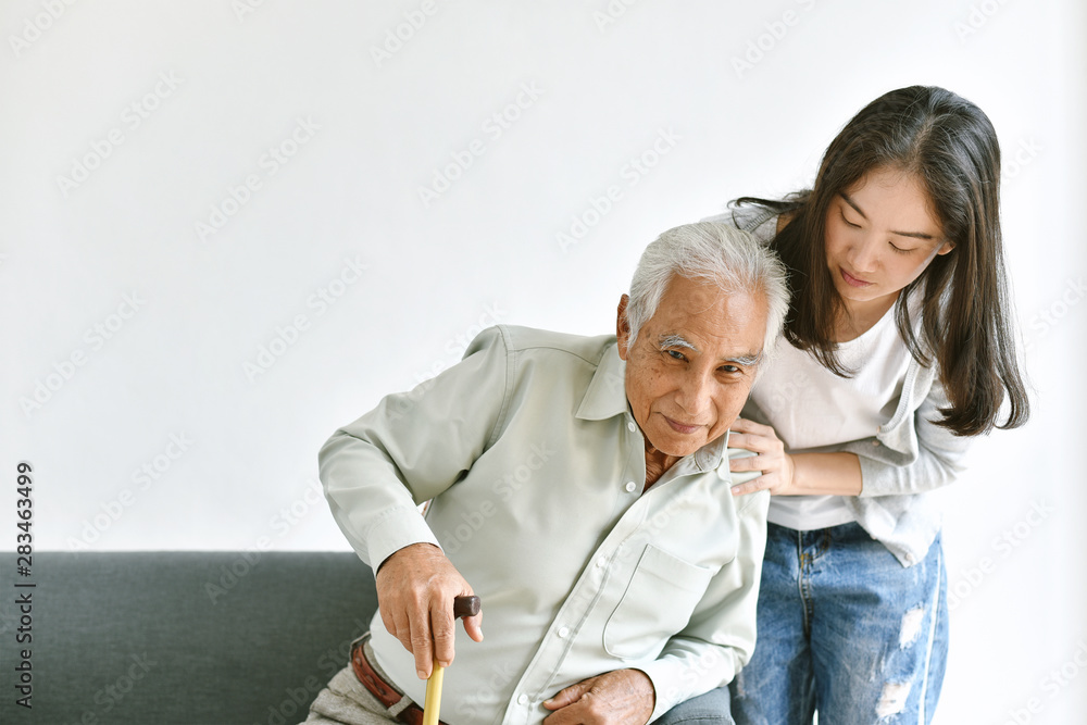 Disable and injury senior asian man try to stand up with walking cane, Knee pain and joint