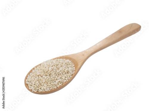White Sesame seeds on wooden spoon isolated on white background.Organic natural sesame seeds and extract oil concept