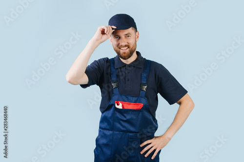 Portrait of a smiling service worker, dressed in uniform photo