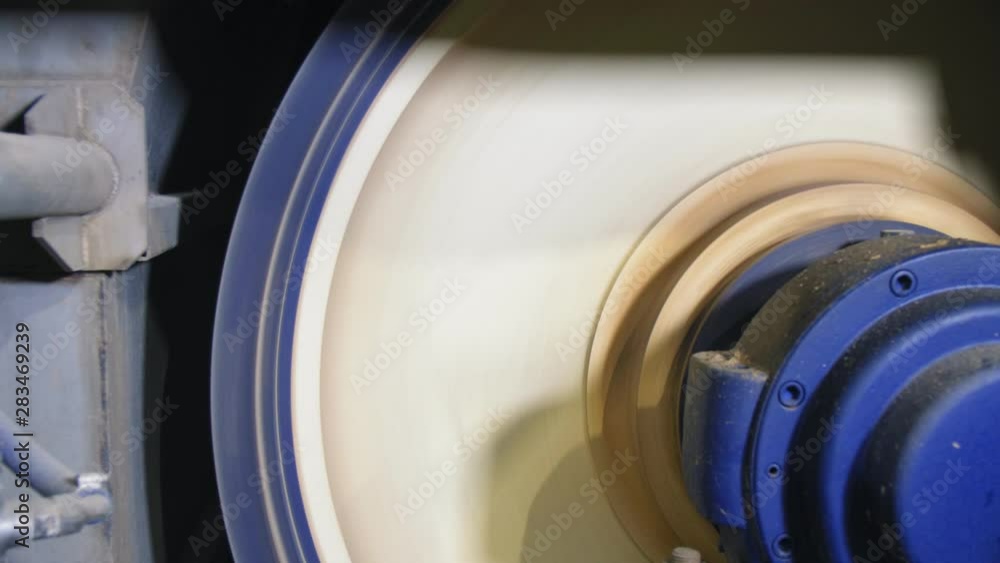 machine with round rotating part operates at plant closeup machine with round rotating part operates at plant closeup
