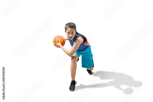 Asian woman basketball player in action with the ball © Leo Lintang