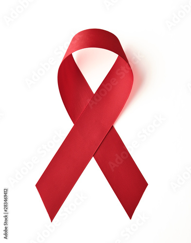 AIDS awareness red ribbon on white background