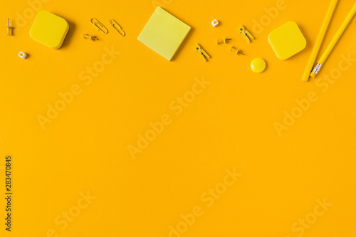 School accessories on a yellow background.