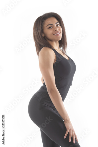 Healthy and Fitness concept - beautiful African American girl in sport clothes after workout. Isolated on white studio background.