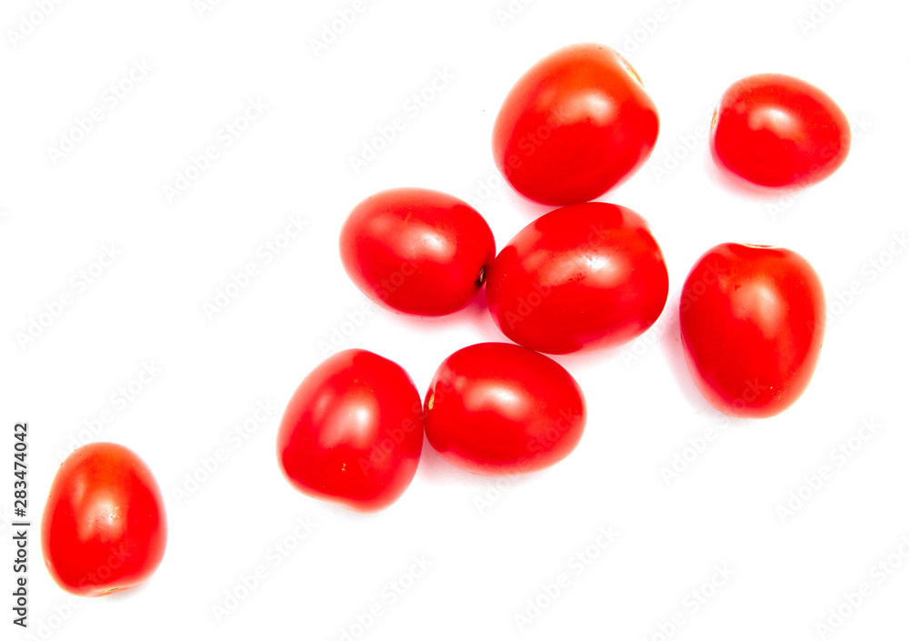 Red cherry tomatoes on a white background Red cherry tomatoes on a white background