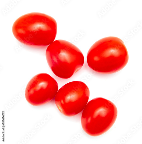 Red cherry tomatoes on a white background