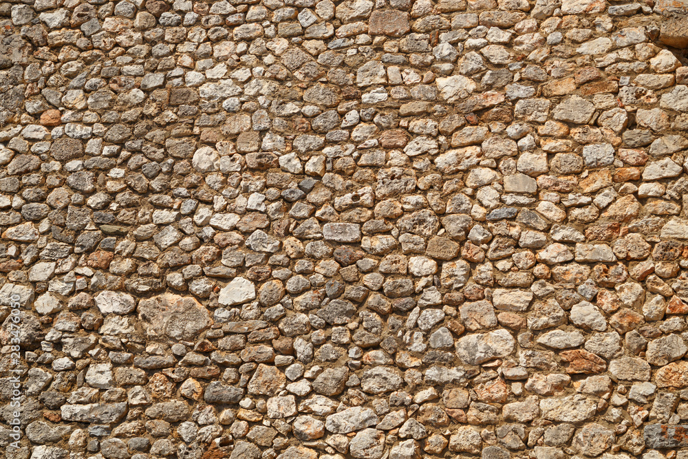Texture of a stone wall. texture background. Part of a stone fortress or castle, for background or texture Texture of a stone wall. texture background. Part of a stone fortress or castle, for background or texture
