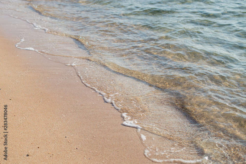 Sea Beach and Soft wave of blue ocean. Summer vacation and travel concept. Copy space Sea Beach and Soft wave of blue ocean. Summer vacation and travel concept. Copy space