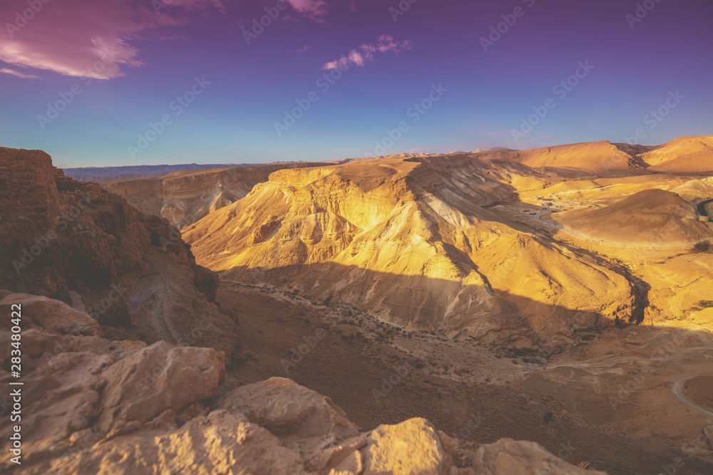 Mountain nature landscape. View of the valley from the mount. Desert in the early morning. The Judaean Desert. Landscape in Dead sea region. Nature Israel