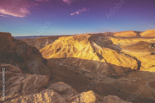 Mountain nature landscape. View of the valley from the mount. Desert in the early morning. The Judaean Desert. Landscape in Dead sea region. Nature Israel