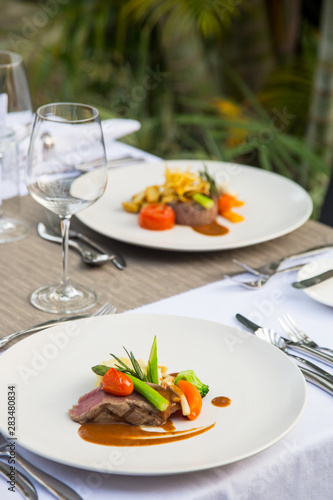 Beefsteak served with steamed vegetables, Exquisite dish, creative restaurant meal concept 