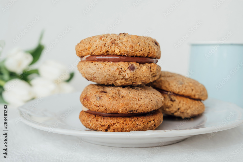 Delicious crumbly sandwich cookies Baci di Dama or Lady kisses with chocolate filling