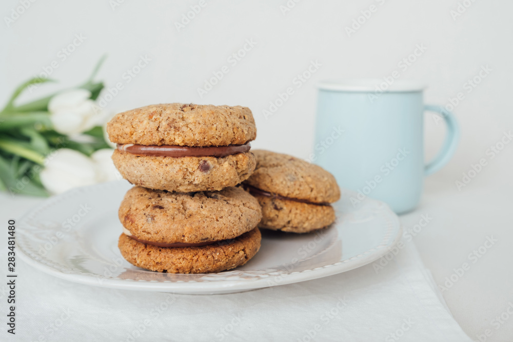 Delicious crumbly sandwich cookies Baci di Dama or Lady kisses with chocolate filling Delicious crumbly sandwich cookies Baci di Dama or Lady kisses with chocolate filling