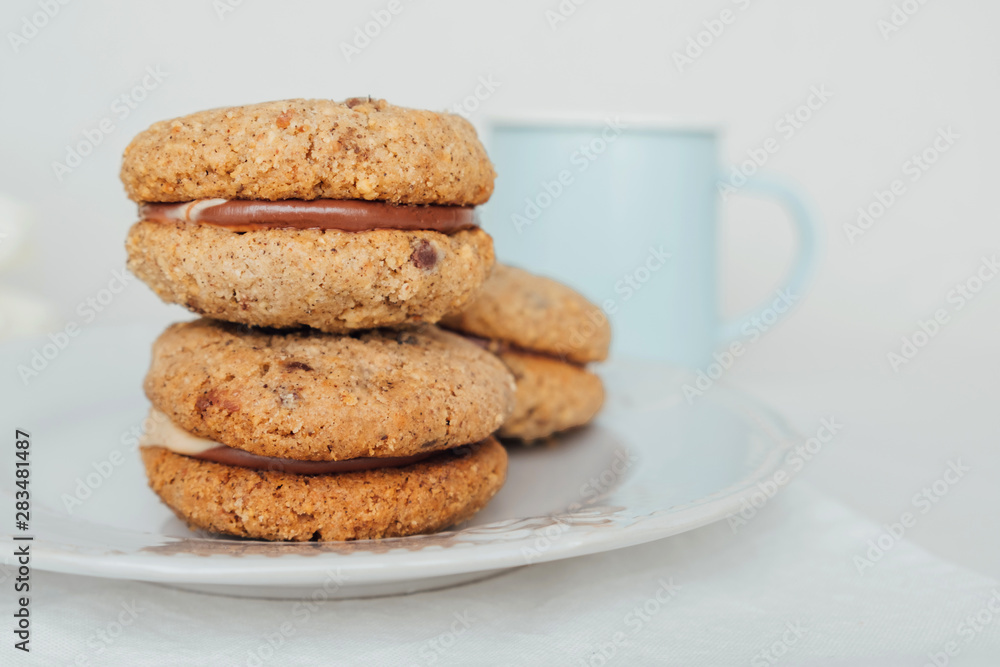 Delicious crumbly sandwich cookies Baci di Dama or Lady kisses with chocolate filling Delicious crumbly sandwich cookies Baci di Dama or Lady kisses with chocolate filling