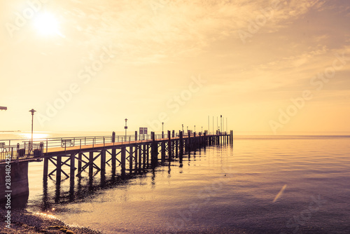 Steg im Wasser bei Sonnenuntergang © dietwalther