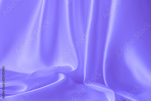 Smooth elegant wavy blue satin silk luxury cloth fabric texture, abstract background design.