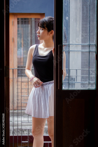 Portrait of thai adult beautiful girl black shirt white skirt relax time Free Download Portrait of thai adult beautiful girl black shirt white skirt relax time - GFXLoad