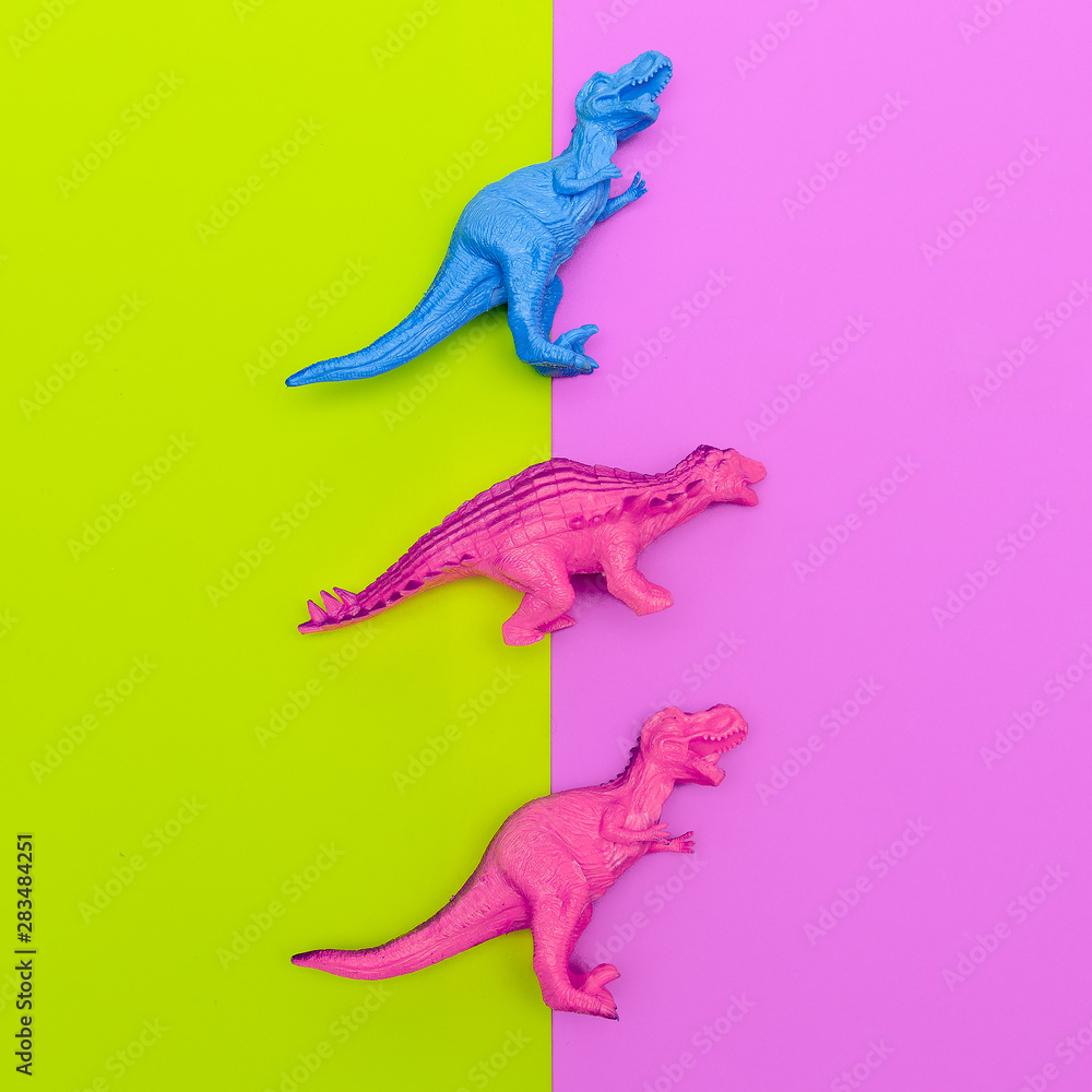 Set Dinosaurs toys on a colored background. Flat lay minimal art Set Dinosaurs toys on a colored background. Flat lay minimal art