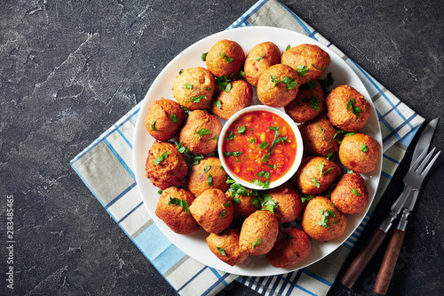 Plantain fritters Klako on a white platter