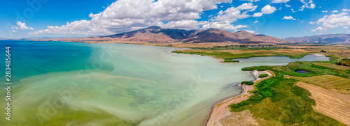 Aerial view of Lake Van the largest lake in Turkey, lies in the far east of that country in the provinces of Van and Bitlis. Fields and cliffs overlooking the crystal clear waters photo