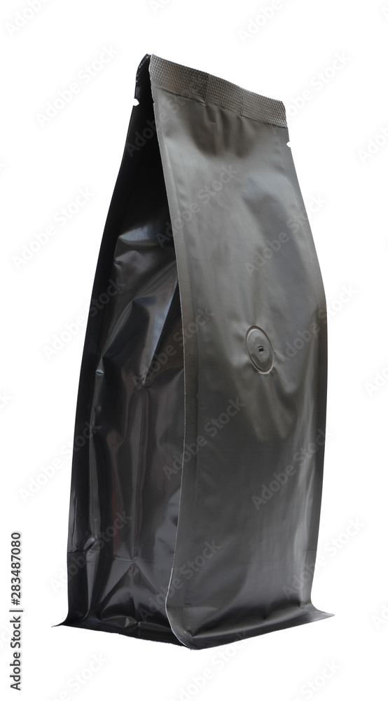 Side of coffee black foil bag with carbon dioxide valve on white background. Side of coffee black foil bag with carbon dioxide valve on white background.