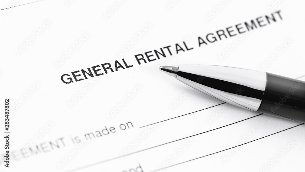 general rental agreement form application with black pen closeup general rental agreement form application with black pen closeup