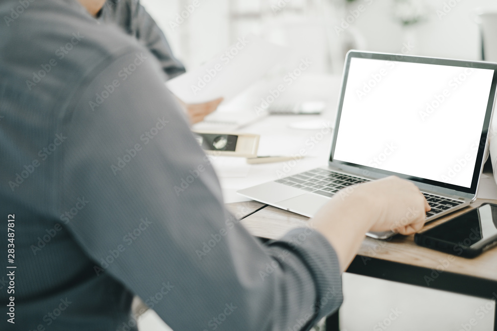 Mockup image of engineers using laptop to drawing design building Project in office, mockup concept Mockup image of engineers using laptop to drawing design building Project in office, mockup concept