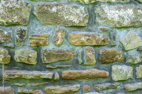 texture of masonry, a fragment of a stone wall of an ancient temple of the 10th century, background, backdrop photo