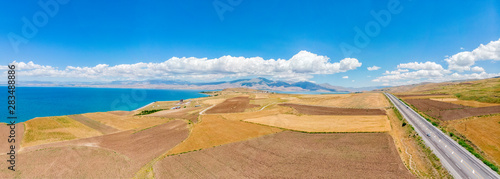 Aerial view of Lake Van the largest lake in Turkey  lies in the far east of that country in the provinces of Van and Bitlis. Fields and cliffs overlooking the crystal waters. Roads along the lake