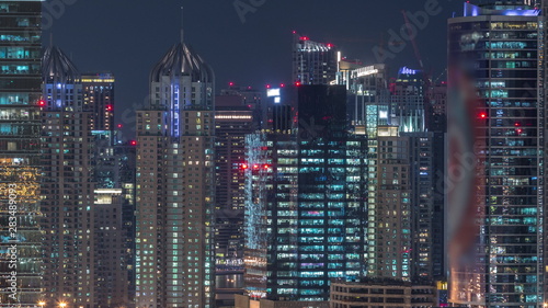 Dubai Marina and JLT aerial night timelapse top view of skyscrapers in Dubai, UAE.