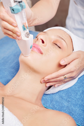 Young Caucasian woman enjoying beauty treatment in spa salon