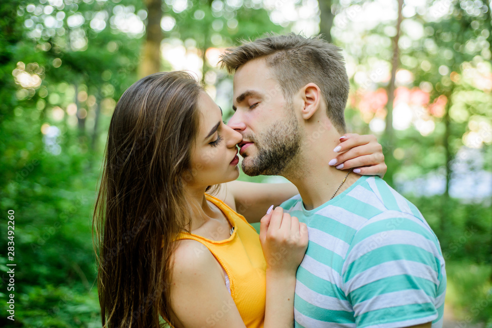 Couple in love kissing with passion outdoors. Man and woman attractive lovers romantic kiss. Passionate kiss concept. Giving kiss. Seduction and foreplay. Sensual kiss of lovely couple close up Couple in love kissing with passion outdoors. Man and woman attractive lovers romantic kiss. Passionate kiss concept. Giving kiss. Seduction and foreplay. Sensual kiss of lovely couple close up