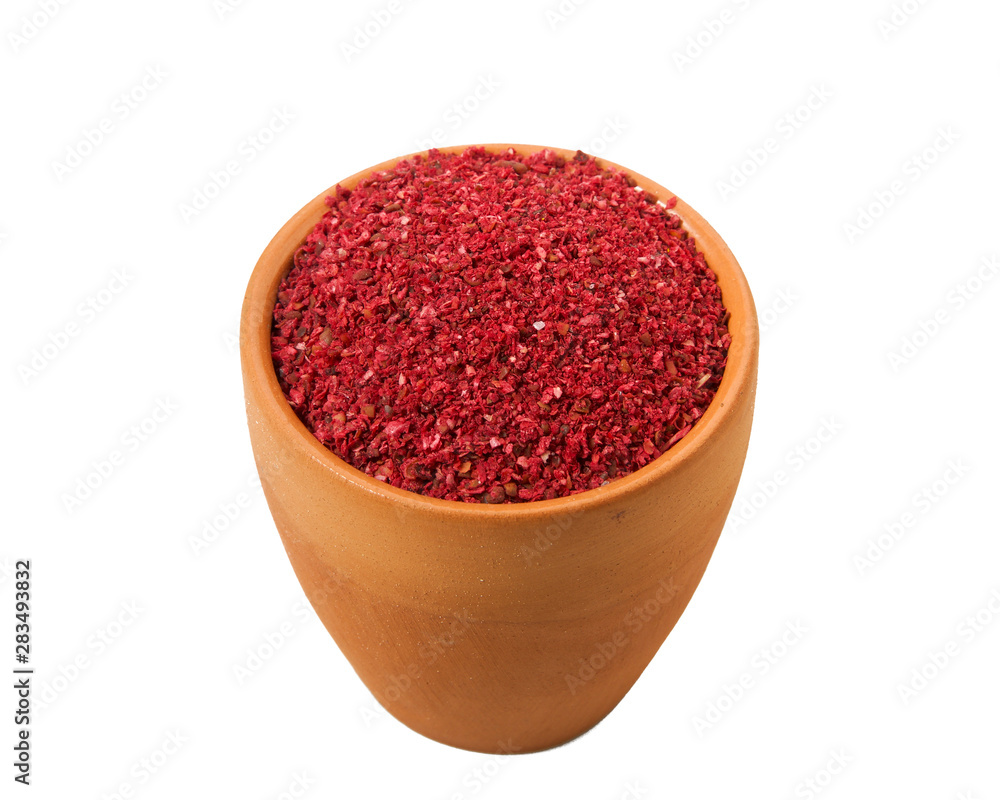 Ground red pepper in a bowl isolated on a white background. View from above. Ground red pepper in a bowl isolated on a white background. View from above.