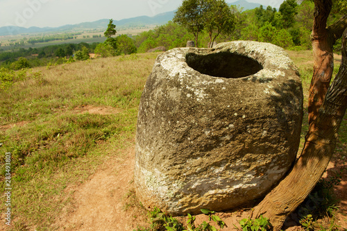 Ancient stone jar in a Plain of Jars (Site #2) near Phonsavan,  Xienghouang province, Laos.. photo