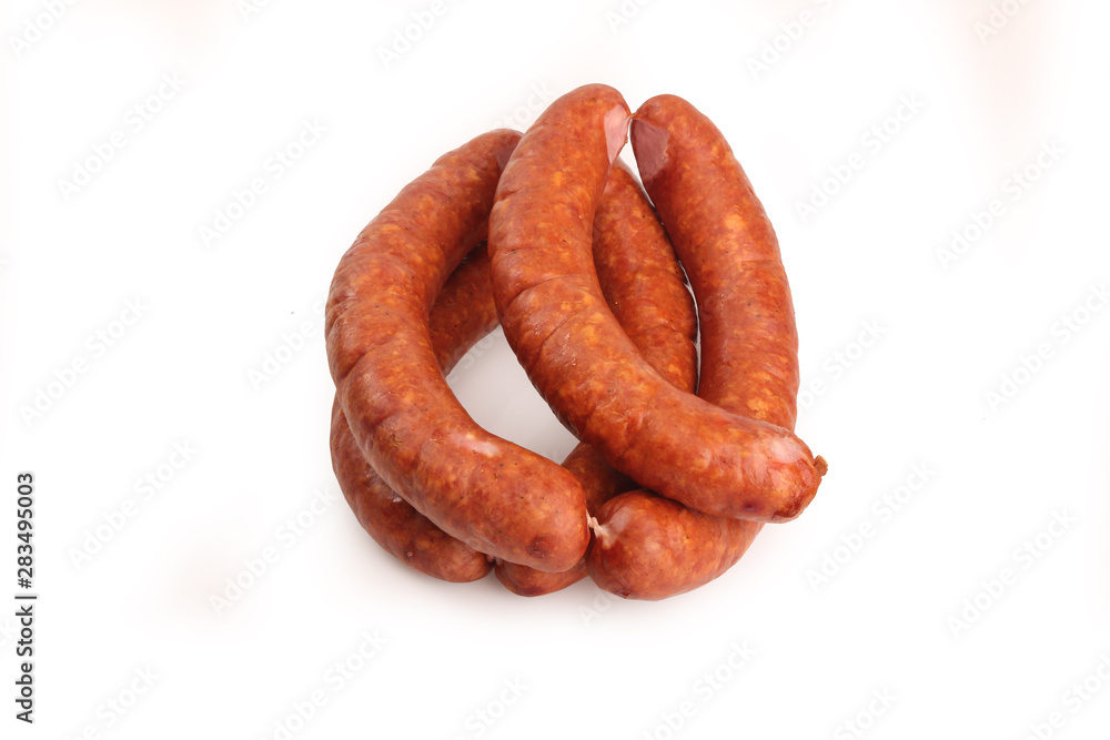Thin sausage on a white background. Food product. Thin sausage on a white background. Food product.