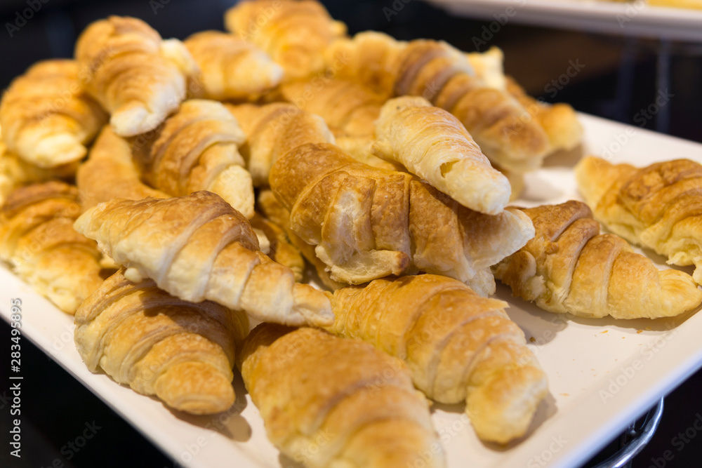 Fresh baked croissants ready to serve. soft focus Fresh baked croissants ready to serve. soft focus