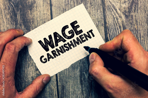 Conceptual hand writing showing Wage Garnishment. Business photo showcasing Deducting money from compensation ordered by the court.