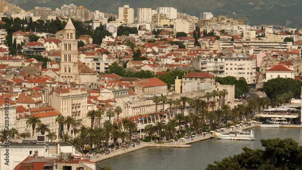 Aerial view across city of Split with palm lined boulevard and pretty old buildings, Croatia. Tight shot. Aerial view across city of Split with palm lined boulevard and pretty old buildings, Croatia. Tight shot.