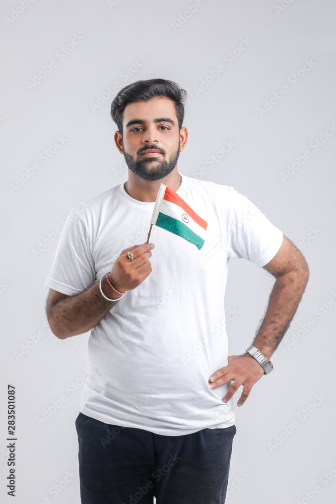 Young indian man with indian flag Young indian man with indian flag