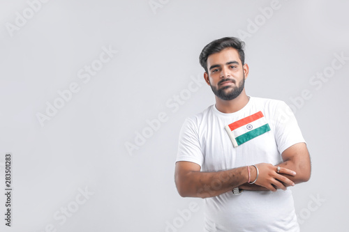 Young indian man with indian flag