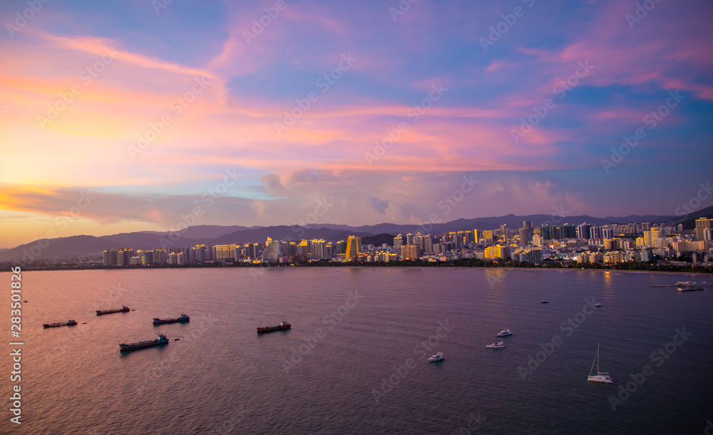 Sanya town evening cityscape, view from Phoenix island on Hainan Island of China