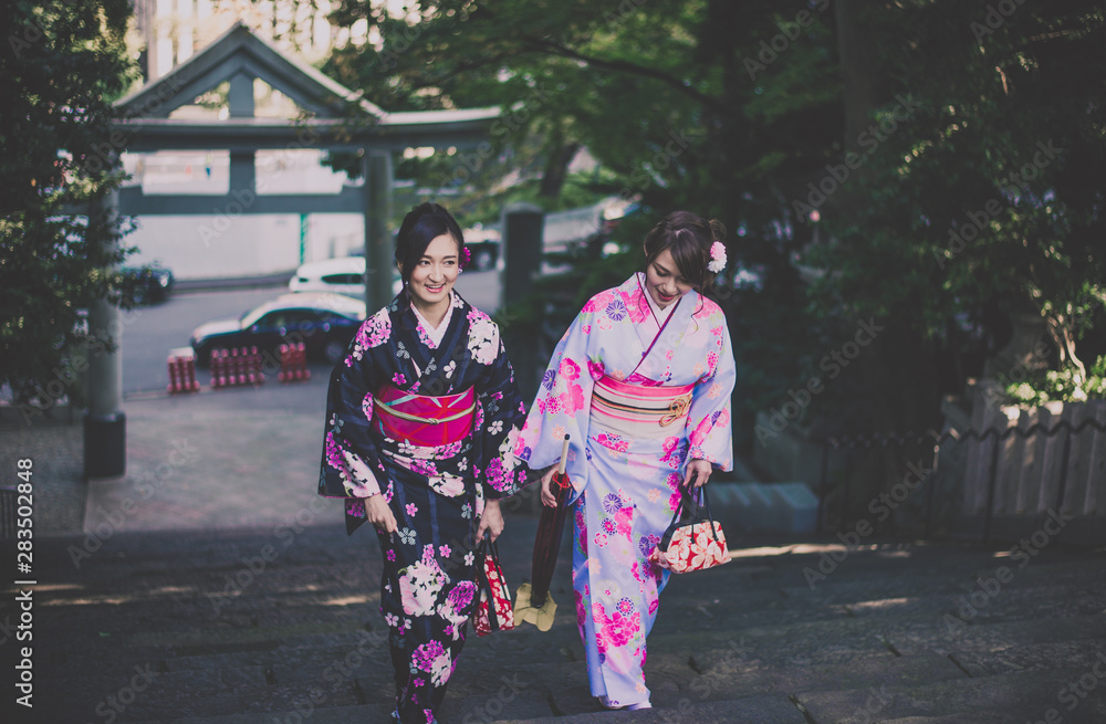 Two japanese girls wearing kimonos traditional clothes, lifestyle moments Two japanese girls wearing kimonos traditional clothes, lifestyle moments