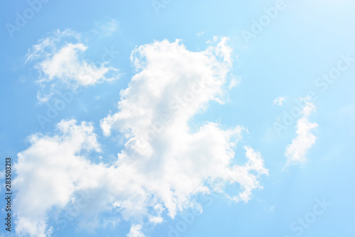 Bright and colorful photos of heavenly angelic white clouds and blue, blue sky with sunlight. Light, delicate and airy cloudy background with white and blue lights and colors. © Daria Katiukha